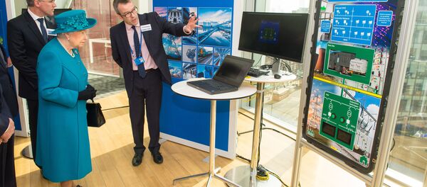Britain's Queen Elizabeth II (2L) listens as Director of Engagement and Advice Alex Dewdney (R) explains how an electricity supply could be subjected to cyber attack, as she attends the opening of the National Cyber Security Centre in London on February 14, 2017. Britain's Queen Elizabeth II (2L) listens as Director of Engagement and Advice Alex Dewdney (R) explains how an electricity supply could be subjected to cyber attack, as she attends the opening of the National Cyber Security Centre in London on February 14, 2017. - Sputnik International