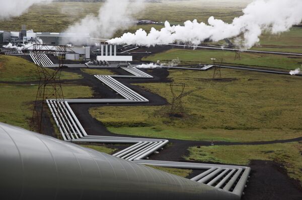 In this July 28, 2011 file photo, giant ducts carry superheated steam from within a volcanic field to the turbines at Reykjavik Energy's Hellisheidi geothermal power plant in Iceland. - Sputnik International