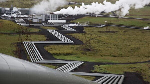 In this July 28, 2011 file photo, giant ducts carry superheated steam from within a volcanic field to the turbines at Reykjavik Energy's Hellisheidi geothermal power plant in Iceland. - Sputnik International