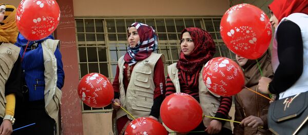 Members from the Rebirth Generation, an internet born group of Iraqi youths who are trying to revive the embattled city of Mosul, pose for a photo as they organise an event to mark Valentine's Day at a school in the eastern part of Mosul on February 14, 2017 Members from the Rebirth Generation, an internet born group of Iraqi youths who are trying to revive the embattled city of Mosul, pose for a photo as they organise an event to mark Valentine's Day at a school in the eastern part of Mosul on February 14, 2017 - Sputnik International