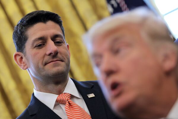 U.S. Speaker of the House Paul Ryan looks at U.S. President Donald Trump as he signs H.J.Res. 41, providing for congressional disapproval of a rule submitted by the Securities and Exchange Commission relating to Disclosure of Payments by Resource Extraction Issuers. at the Oval Office of the White House in Washington, U.S., February 14, 2017 U.S. Speaker of the House Paul Ryan looks at U.S. President Donald Trump as he signs H.J.Res. 41, providing for congressional disapproval of a rule submitted by the Securities and Exchange Commission relating to Disclosure of Payments by Resource Extraction Issuers. at the Oval Office of the White House in Washington, U.S., February 14, 2017 - Sputnik International