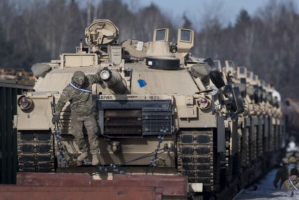 Abrams battle tanks from the US Army's 4th Infantry Division 3rd Brigade Combat Team 68th Armor Regiment 1st Battalion on rail cars as they arrive at the Gaiziunai railway station some 110 kms (69 miles) west of the capital Vilnius, Lithuania, Friday, Feb. 10, 2017. Abrams battle tanks from the US Army's 4th Infantry Division 3rd Brigade Combat Team 68th Armor Regiment 1st Battalion on rail cars as they arrive at the Gaiziunai railway station some 110 kms (69 miles) west of the capital Vilnius, Lithuania, Friday, Feb. 10, 2017. - Sputnik International