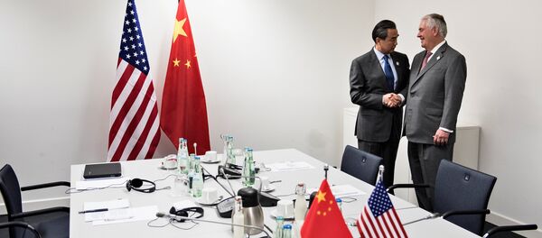 US Secretary of State Rex Tillerson (R) is greeted by China's Foreign Minister Wang Yi before a meeting at the World Conference Center February 17, 2017 in Bonn, western Germany. - Sputnik International
