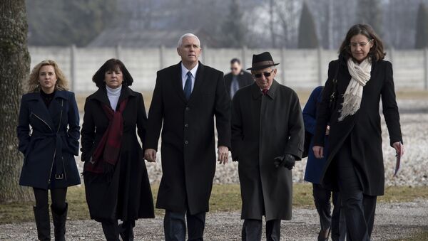 US Vice President Mike Pence, center, his wife Karen, second from left, and his daughter Charlotte, left, are lead by Holocaust survivor Abba Naor, second from right, as they visit the former Nazi concentration camp in Dachau near Munich, southern Germany, Sunday, Feb. 19, 2017, one day after he attended the Munich Security Conference. - Sputnik International