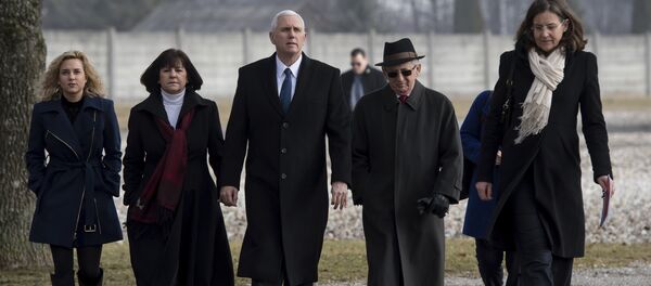 US Vice President Mike Pence, center, his wife Karen, second from left, and his daughter Charlotte, left, are lead by Holocaust survivor Abba Naor, second from right, as they visit the former Nazi concentration camp in Dachau near Munich, southern Germany, Sunday, Feb. 19, 2017, one day after he attended the Munich Security Conference. - Sputnik International