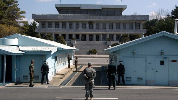 A view from South Korea towards North Korea in the Joint Security Area at Panmunjom. North and South Korean military personnel, as well as a single US soldier, are shown - Sputnik International