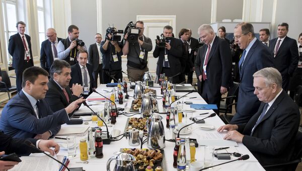 The Ukrainian Foreign minister Pavlo Klimkin , left, the German Foreign Minister Sigmar Gabriel, second left, the French Foreign Minister Jean-Marc Ayrault, right, and the Russian Foreign Minister Sergey Lavrov, second right, discuss during a meeting at the Security Conference in Munich, Germany, Saturday, Feb. 18, 2017 - Sputnik International