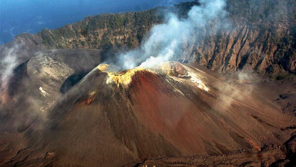 Smoke rises from the Barren Island volcano, 135 kilometers (84 miles) east of Port Blair, India on Sunday, March 25, 2007 - Sputnik International