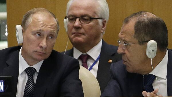 Russia's President Vladimir Putin, left, Foreign Minister Sergey Lavrov, right, and Ambassador to the United Nations Vitaly Churkin listen to speakers during the 70th session of the United Nations General Assembly at U.N. headquarters, Monday, Sept. 28, 2015 - Sputnik International