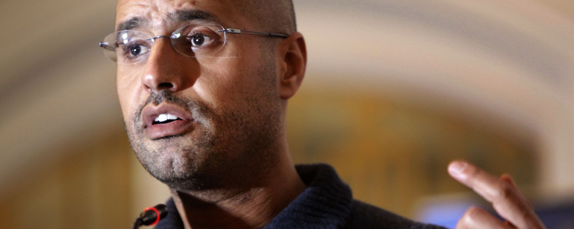 In this Feb. 25, 2011, file photo, Seif al-Islam Gadhafi, son of Libyan leader Moammar Gadhafi, speaks to the media at a press conference in a hotel in Tripoli, Libya - Sputnik International, 1920, 14.11.2021