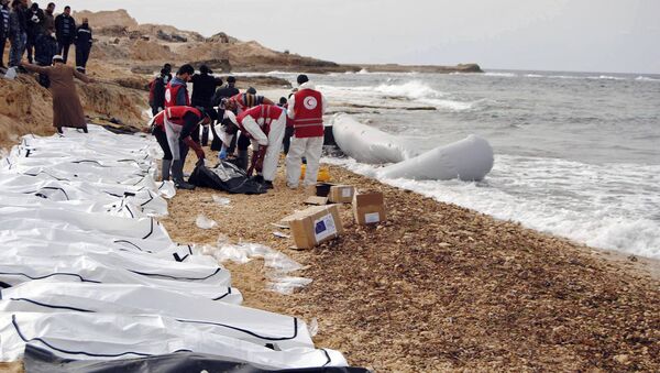 This Monday, Feb. 20, 2017 photo provided by The International Federation of Red Cross and Red Crescent Societies (IFRC), shows the bodies of people that washed ashore and were recovered by the Libyan Red Crescent, near Zawiya, Libya - Sputnik International