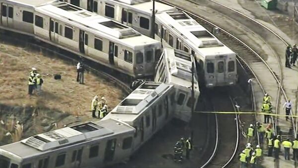 In this image from video provided by WPVI, officials investigate an accident involving out-of-service commuter trains in Upper Darby, Pa., Tuesday, Feb. 21, 2017 - Sputnik International