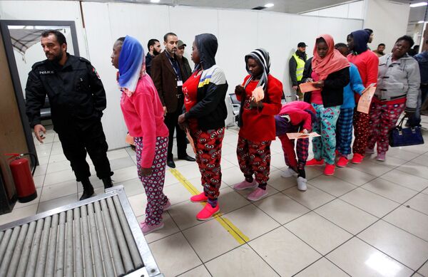 African migrants wait to be deported at Mitiga International Airport, east of Tripoli, Libya, February 14, 2017. African migrants wait to be deported at Mitiga International Airport, east of Tripoli, Libya, February 14, 2017. - Sputnik International