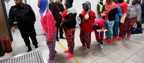 African migrants wait to be deported at Mitiga International Airport, east of Tripoli, Libya, February 14, 2017. - Sputnik International