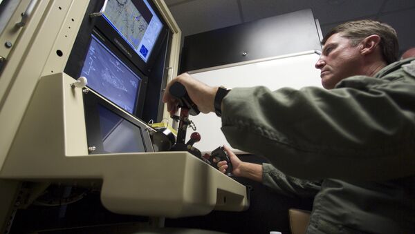 Col. Charles W. Manley, commander of the 163d Maintenance Group,163d Reconnaissance Wing, pilots a training simulator for the U.S. Air Force's MQ-1 Predator, at the March Air Reserve Base in Riverside County, Calif., in this June 25, 2008 file photo - Sputnik International