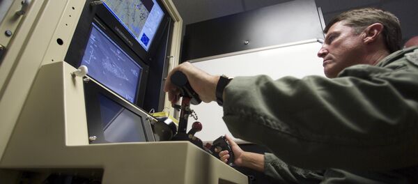 Col. Charles W. Manley, commander of the 163d Maintenance Group,163d Reconnaissance Wing, pilots a training simulator for the U.S. Air Force's MQ-1 Predator, at the March Air Reserve Base in Riverside County, Calif., in this June 25, 2008 file photo - Sputnik International