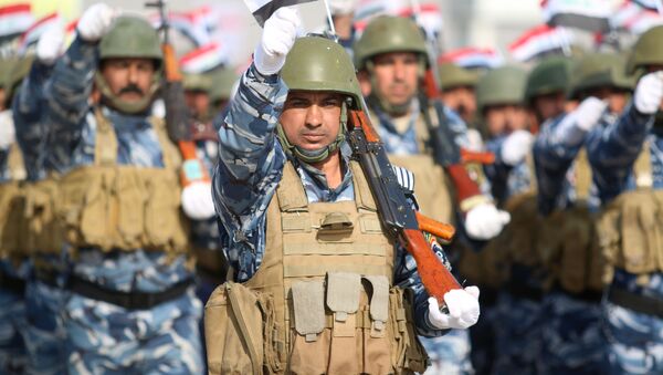 Iraqi policemen march during a ceremony to mark the 95th anniversary of the creation of the Iraqi police at the Shaabiyah training camp in the southern city of Basra on January 9, 2017 - Sputnik International