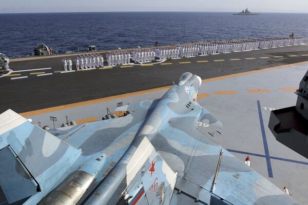 Officers and crew in parade uniforms on the flight deck of the Admiral Kuznetsov. Officers and crew in parade uniforms on the flight deck of the Admiral Kuznetsov. - Sputnik International