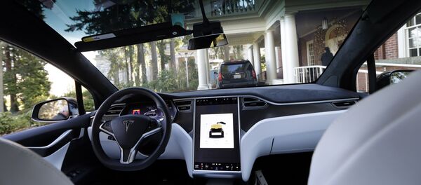 The interior of a Tesla Model X 75D semi-autonomous electric vehicle The interior of a Tesla Model X 75D semi-autonomous electric vehicle - Sputnik International