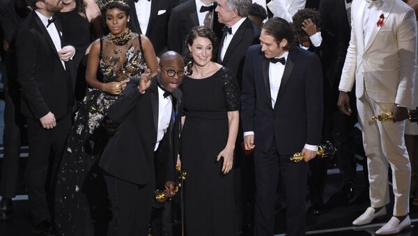 Barry Jenkins, foreground left, and the cast accept the award for best picture for Moonlight at the Oscars on Sunday, Feb. 26, 2017, at the Dolby Theatre in Los Angeles. - Sputnik International