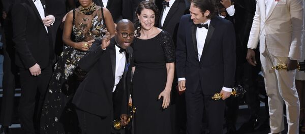 Barry Jenkins, foreground left, and the cast accept the award for best picture for Moonlight at the Oscars on Sunday, Feb. 26, 2017, at the Dolby Theatre in Los Angeles. Barry Jenkins, foreground left, and the cast accept the award for best picture for Moonlight at the Oscars on Sunday, Feb. 26, 2017, at the Dolby Theatre in Los Angeles. - Sputnik International