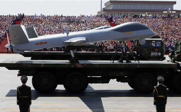 Military vehicles carry Wing Loong drones, a Chinese made medium-altitude long-endurance unmanned aerial vehicle, past spectators during a parade commemorating the 70th anniversary of Japan's surrender during World War II held in front of Tiananmen Gate in Beijing, Thursday, Sept. 3, 2015 Military vehicles carry Wing Loong drones, a Chinese made medium-altitude long-endurance unmanned aerial vehicle, past spectators during a parade commemorating the 70th anniversary of Japan's surrender during World War II held in front of Tiananmen Gate in Beijing, Thursday, Sept. 3, 2015 - Sputnik International