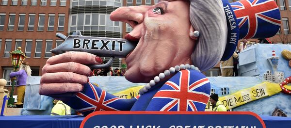 A carnival float depicts British Prime Minister Theresa May with a gun and the writing 'Brexit' on it prior to the traditional carnival parade in Duesseldorf, Germany, on Monday, Feb. 27, 2017. A carnival float depicts British Prime Minister Theresa May with a gun and the writing 'Brexit' on it prior to the traditional carnival parade in Duesseldorf, Germany, on Monday, Feb. 27, 2017. - Sputnik International
