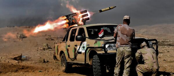 Members of the Iraqi army's 9th Division fire a multiple rocket launcher from a hill in Talul al-Atshana, on the southwestern outskirts of Mosul, on February 27, 2017, during an offensive to retake the city from Islamic State (IS) group fighters - Sputnik International