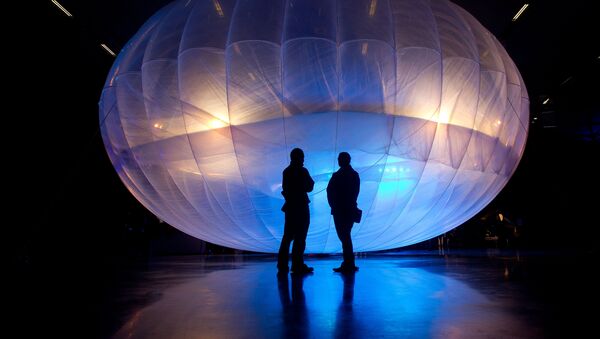 Visitors stand next to a high altitude WiFi internet hub, a Google Project Loon balloon (File) - Sputnik International