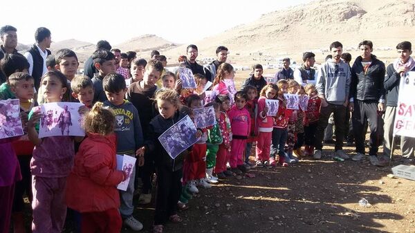 Yazidi rally at a refugee camp n Sinjar Mountains, Iraq Yazidi rally at a refugee camp n Sinjar Mountains, Iraq - Sputnik International