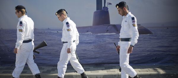 Israeli naval soldiers honor guard walks past a poster of a submarine as they wait for the arrival of a new navy submarine Rahav in the military port in Haifa, Israel, Tuesday, Jan. 12, 2016. Israeli naval soldiers honor guard walks past a poster of a submarine as they wait for the arrival of a new navy submarine Rahav in the military port in Haifa, Israel, Tuesday, Jan. 12, 2016. - Sputnik International