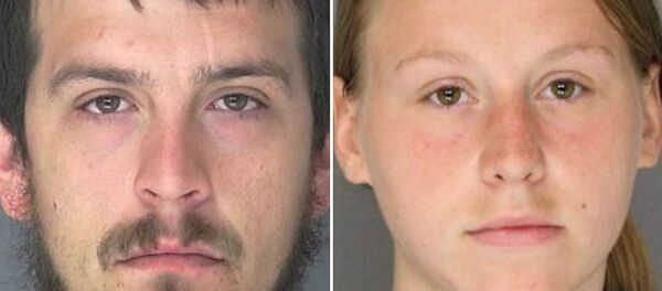 Couple Sent to Prison for Terrorizing Black Family With Guns, Confederate Flags - Sputnik International