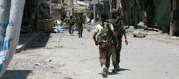 Members of the Syrian Democratic Forces (SDF) patrol a street in the northern Syrian town of Manbij (File) - Sputnik International