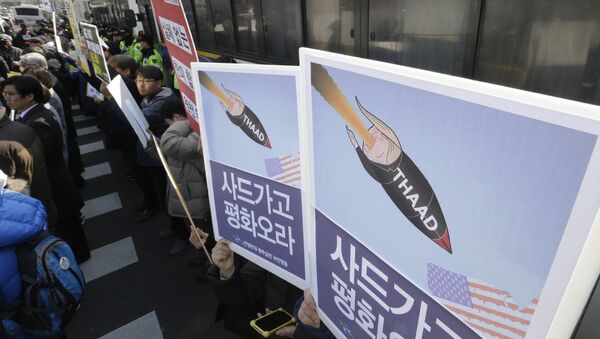 South Korean protesters stage a rally to oppose a plan to deploy an advanced U.S. missile defense system called Terminal High-Altitude Area Defense, or THAAD, in front of the Defense Ministry in Seoul, South Korea, Tuesday, Feb. 28, 2017 - Sputnik International