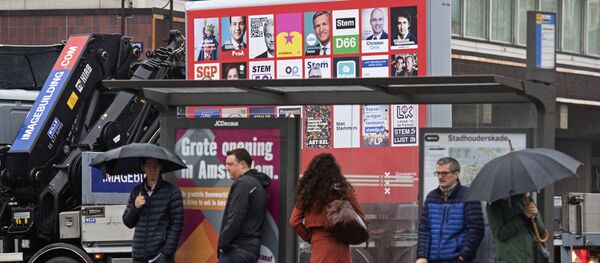 A picture shows a placard with the election posters of all parties for the Dutch national elections in Amsterdam, on February 20, 2017 A picture shows a placard with the election posters of all parties for the Dutch national elections in Amsterdam, on February 20, 2017 - Sputnik International