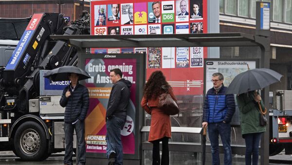 A picture shows a placard with the election posters of all parties for the Dutch national elections in Amsterdam, on February 20, 2017 - Sputnik International