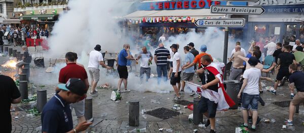 French police use tear gas against England supporters in downtown Marseille, France, Friday, June 10, 2016 - Sputnik International