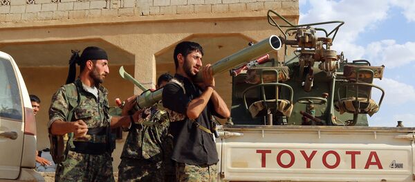 US-backed Kurdish and Arab fighters prepare a rocket-launcher as they advance into the Islamic State (IS) jihadist's group bastion of Manbij, in northern Syria (File) - Sputnik International