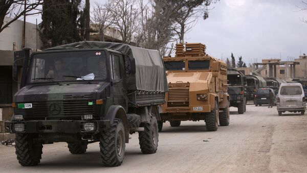 Turkish military vehicles drive in the Syrian rebel-held town of al-Rai, as they head towards the northern Syrian town of al-Bab, Syria March 2, 2017 - Sputnik International