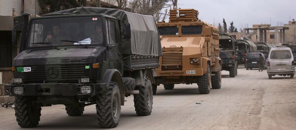 Turkish military vehicles drive in the Syrian rebel-held town of al-Rai, as they head towards the northern Syrian town of al-Bab, Syria March 2, 2017 - Sputnik International