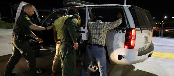 U.S. border patrol agents detain two men from India after they entered the United States by climbing over the border wall from Mexico in Calexico, California, U.S. February 8, 2017 U.S. border patrol agents detain two men from India after they entered the United States by climbing over the border wall from Mexico in Calexico, California, U.S. February 8, 2017 - Sputnik International