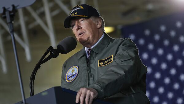 President Donald Trump reads from a teleprompter during a speech aboard the nuclear aircraft carrier Gerald R. Ford, at Newport News Shipbuilding in Newport News, Va., Thursday, March 2, 2017. - Sputnik International