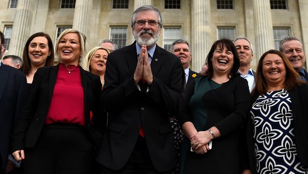 Sinn Fein President Gerry Adams gestures as he and Sinn Fein leader Michelle O'Neill introduce the new Sinn Fein Assembly team at Parliament buildings in Belfast, Northern Ireland March 6, 2017. - Sputnik International