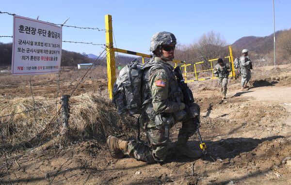 US soldiers take a position during their drill at a military training field in the border city of Paju on March 7, 2017. The US military has begun deploying the THAAD anti-ballistic missile defense system to South Korea, US Pacific Command said, with its first elements arriving on March 6, to protect against threats from North Korea US soldiers take a position during their drill at a military training field in the border city of Paju on March 7, 2017. The US military has begun deploying the THAAD anti-ballistic missile defense system to South Korea, US Pacific Command said, with its first elements arriving on March 6, to protect against threats from North Korea - Sputnik International