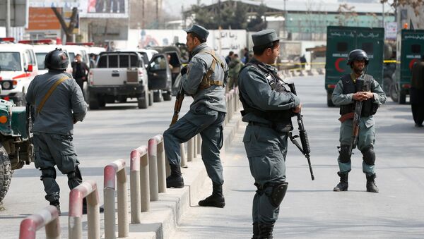 Afghan policemen keep watch at the site of a blast and gunfire at a military hospital in Kabul, Afghanistan March 8, 2017 - Sputnik International