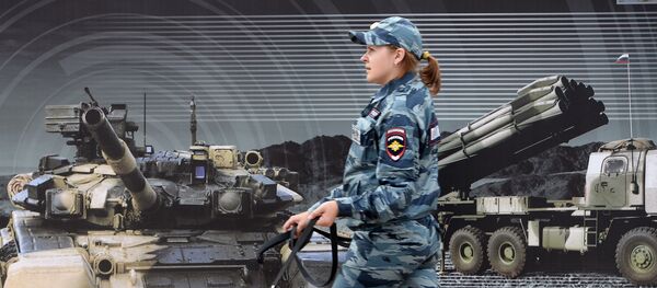 A police officer walks against a Rosobornexport banner at the Army 2016 International military and technical forum A police officer walks against a Rosobornexport banner at the Army 2016 International military and technical forum - Sputnik International