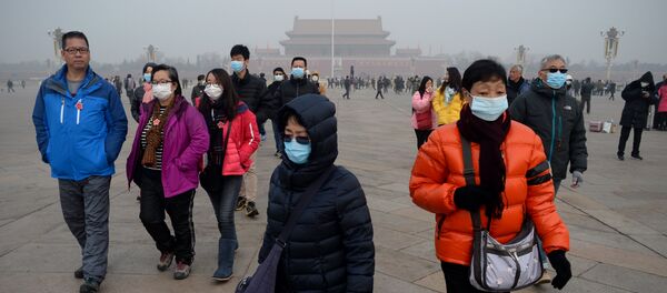 A group of people wearing masks visit Tiananmen Square in Beijing on December 21, 2016 A group of people wearing masks visit Tiananmen Square in Beijing on December 21, 2016 - Sputnik International