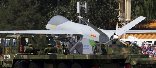 A military vehicle carrying a Wing Loong, a Chinese made medium altitude long endurance unmanned aerial vehicle, drives past during a military parade at Tiananmen Square in Beijing (File) A military vehicle carrying a Wing Loong, a Chinese made medium altitude long endurance unmanned aerial vehicle, drives past during a military parade at Tiananmen Square in Beijing (File) - Sputnik International