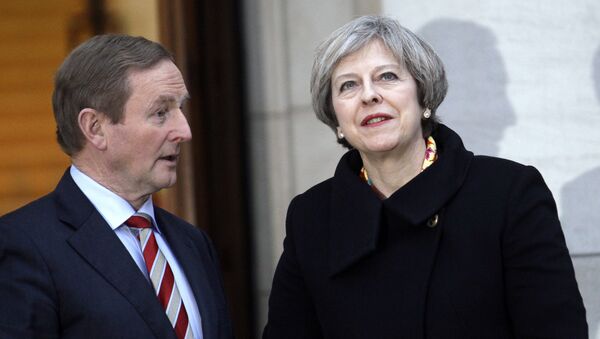 British Prime Minister Theresa May, right, talks with Irish Prime Minister Enda Kenny after arriving for a meeting at government buildings, Dublin, Ireland, Monday, Jan. 30, 2017. - Sputnik International