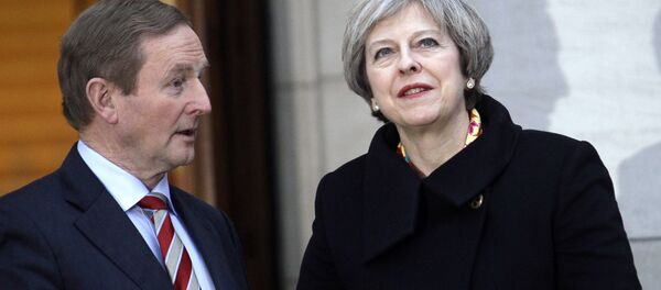 British Prime Minister Theresa May, right, talks with Irish Prime Minister Enda Kenny after arriving for a meeting at government buildings, Dublin, Ireland, Monday, Jan. 30, 2017. British Prime Minister Theresa May, right, talks with Irish Prime Minister Enda Kenny after arriving for a meeting at government buildings, Dublin, Ireland, Monday, Jan. 30, 2017. - Sputnik International